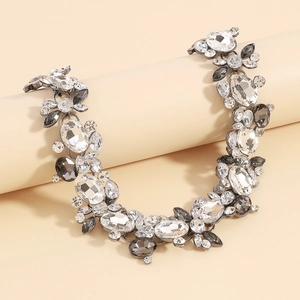 Macro detail of luxury statement necklace with multi-faceted crystals and silver alloy base
