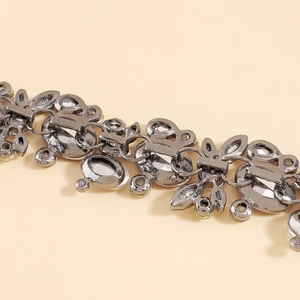Detail of vintage gunmetal necklace featuring intricate butterfly links and crystals