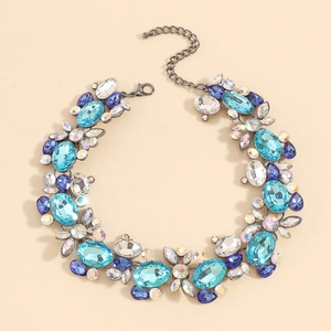 Macro shot of bohemian statement necklace with multicolor blue crystals and metal chain