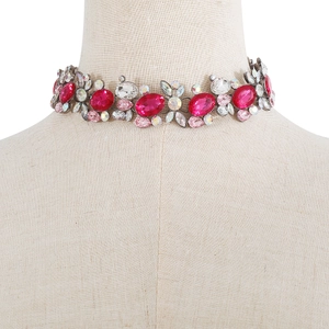 Close-up of vintage luxury choker featuring large pink crystals and rhinestones
