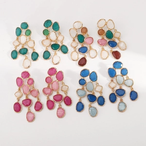 Modern bohemian resin dangle earrings with irregular geometric shapes and gold metal edges