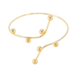 Minimalist gold metal open arm cuff with wavy curve design and polished gold beads