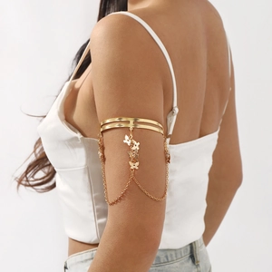 Bohemian gold arm cuff with butterfly pendants and long chain tassels for women