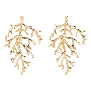 Macro shot of gold coral branch earrings with detailed organic textured metal finish