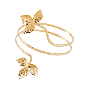 Detailed macro view of golden leaf arm cuff with realistic texture and spiral design