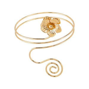 Detailed view of the layered gold-tone flower arm cuff with elegant spiral design