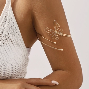 Elegant gold butterfly open upper arm cuff bracelet with a minimalist filigree design