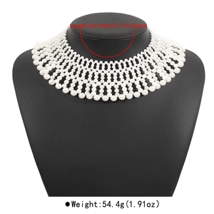 Detail view of woven faux pearl collar necklace showing 35+10cm length on display bust