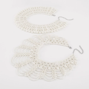 Detail of handmade faux pearl collar necklaces with silver lobster clasp and extension chain
