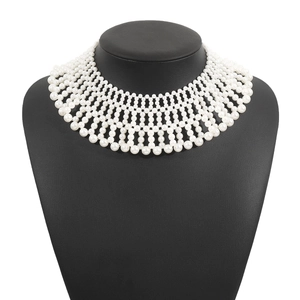 Detailed view of luxury multi-layer hand-woven faux pearl bib collar necklace on display