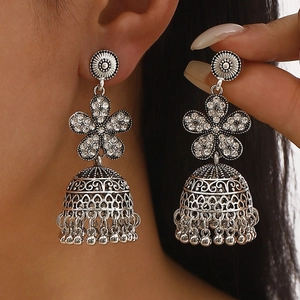 Bohemian silver bell earrings with vintage flower design and shimmering rhinestones
