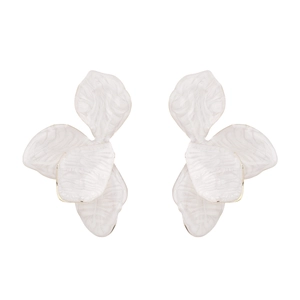 Detail of white marble textured floral earrings with elegant gold-plated metal edges