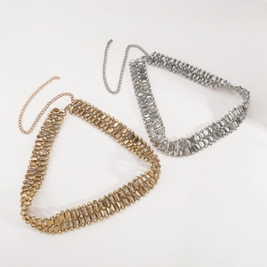 Detail of adjustable double-layered metal link waist chains in gold and silver plating