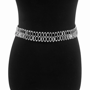 Detail of silver double-layered metal waist chain featuring flat round links and beads