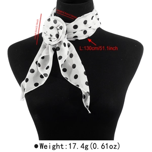 Detailed view of black and white polka dot scarf with 3D flower accent and size guide
