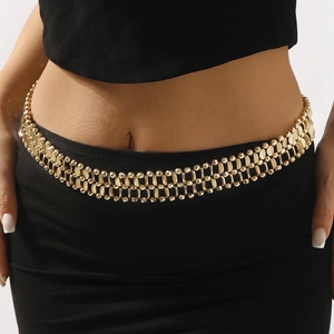 Double-layered golden metal waist chain on a black dress with retro punk style textures