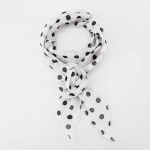Detailed view of white polka dot silk scarf featuring a stylish 3D fabric rose flower