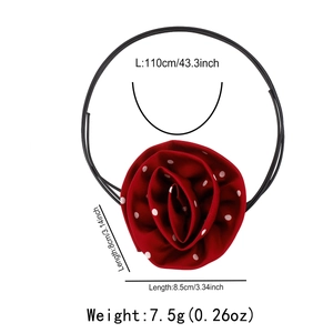 Detail of red polka dot fabric rose choker with dimensions 110cm cord and 8.5cm flower
