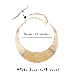 Macro detail of golden textured choker with geometric patterns and size dimensions