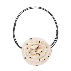 Detail of satin cream rose choker with black polka dots on delicate dual black cords