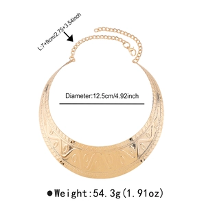 Detail showing gold choker necklace dimensions with ethnic textured relief patterns