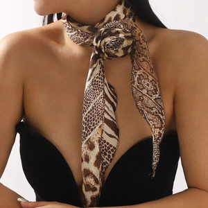 Fashionable leopard and snake print silk scarf tied in a rose knot for neck decoration