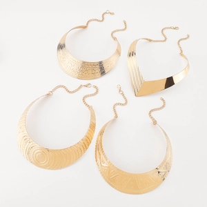 Detailed set of four textured gold chokers with adjustable lobster claw clasps