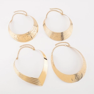Detail view of four gold-toned textured choker necklaces with adjustable lobster clasps