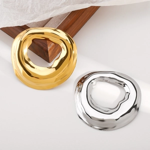 Modern irregular geometric stainless steel brooches in polished gold and silver finishes