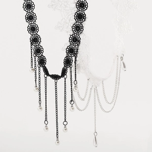 Detail of gothic lace chokers in black and white with metal chain fringe and pearls