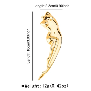 Macro detail of abstract female silhouette pendant showing dimensions and golden finish