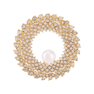 Elegant gold round brooch with sparkling crystals and a large central white pearl