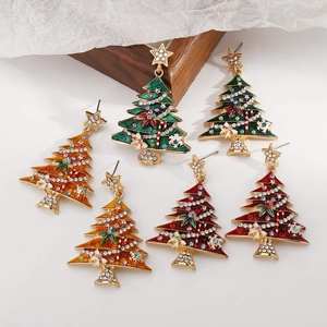Detail view of festive Christmas tree earrings with colorful enamel and sparkling rhinestones