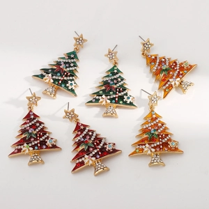 Detailed macro shot of vintage enamel Christmas tree earrings with sparkling rhinestones