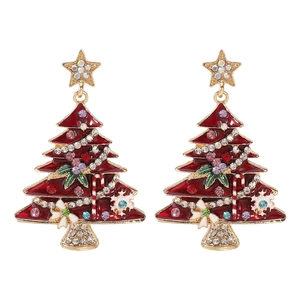 Macro detail of Christmas tree earrings with red enamel, rhinestones and festive charms