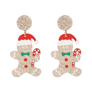 Vue détaillée des boucles d'oreilles bonhomme de pain d'épice avec paillettes de Noël