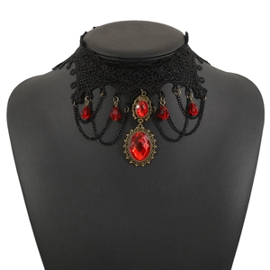 Detail of gothic lace choker with red gemstone pendant and Victorian drop charms