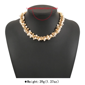 Close-up of elegant pearl and gold bead necklace with detailed size and weight specs