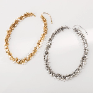 Detailed macro view of woven pearl beaded necklaces in gold and silver finish with clasps