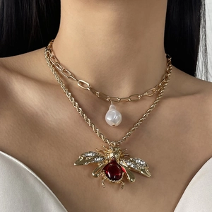 Vintage gold layered necklace with pearl drop and large bee pendant with red gemstone