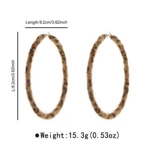Detail view of plush leopard print hoop earrings showing 9.2cm size and 15.3g weight