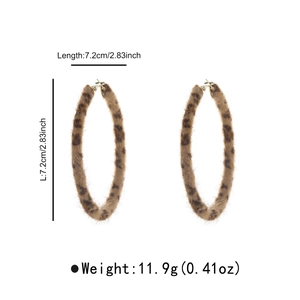 Detail shot of large leopard print plush hoop earrings showing texture and 7.2cm diameter