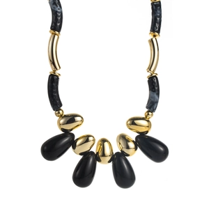 Detail of retro black and gold acrylic beaded necklace with polished teardrop charms