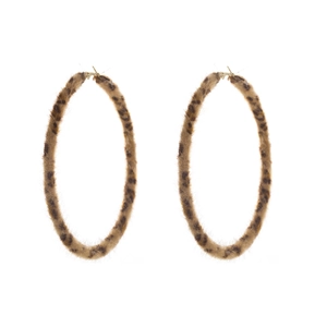 Macro shot of large leopard print plush hoop earrings with golden metal fastening