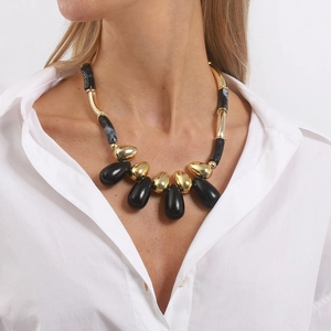 Retro acrylic beaded necklace with marbled resin and gold metal components on model