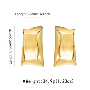 Detail showing dimensions of gold irregular geometric earrings with wavy metal texture