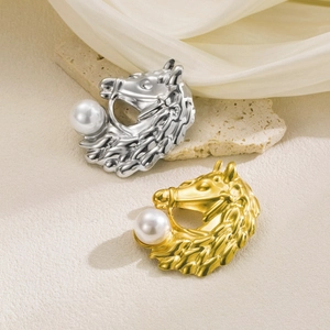 Elegant horse head brooch with faux pearl in gold and silver finish on silk fabric