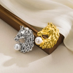 Elegant horse head brooch with large faux pearl in gold and silver finish on silk fabric