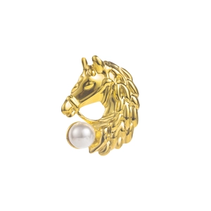 Close-up of golden horse head brooch featuring a glossy white pearl and intricate mane detail
