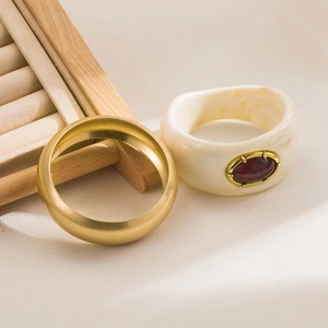 Vintage style gold cuff bracelet set with marble resin and a faux amber gemstone inlay